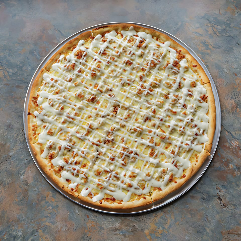 A D-Ray's Pizzeria white pizza with chicken and a lattice of creamy sauce on a metal tray.